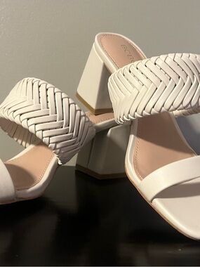 BCBG  Woven Strap Block Heel Mules in the color Bone